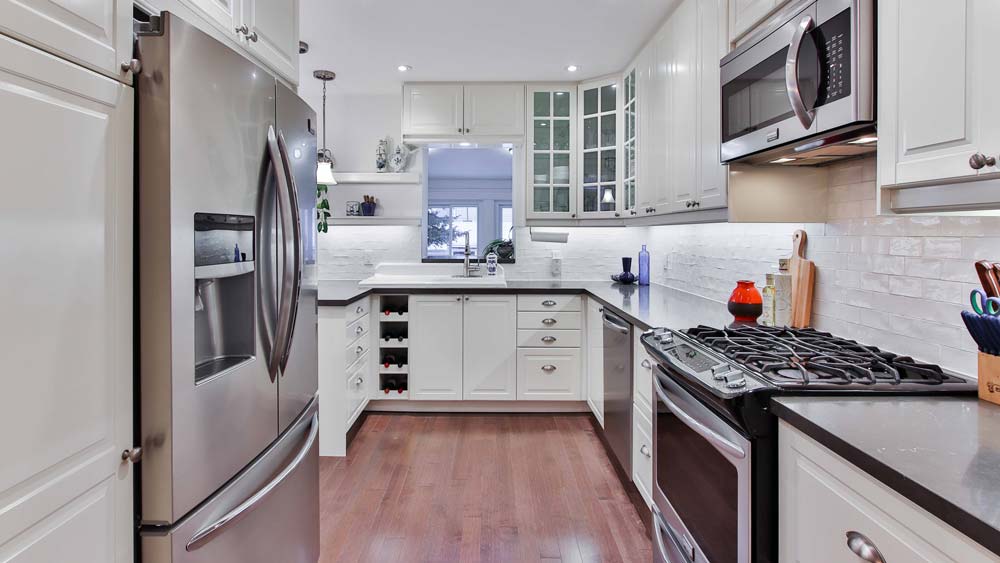 A sleek, modern kitchen with a french door refrigerator